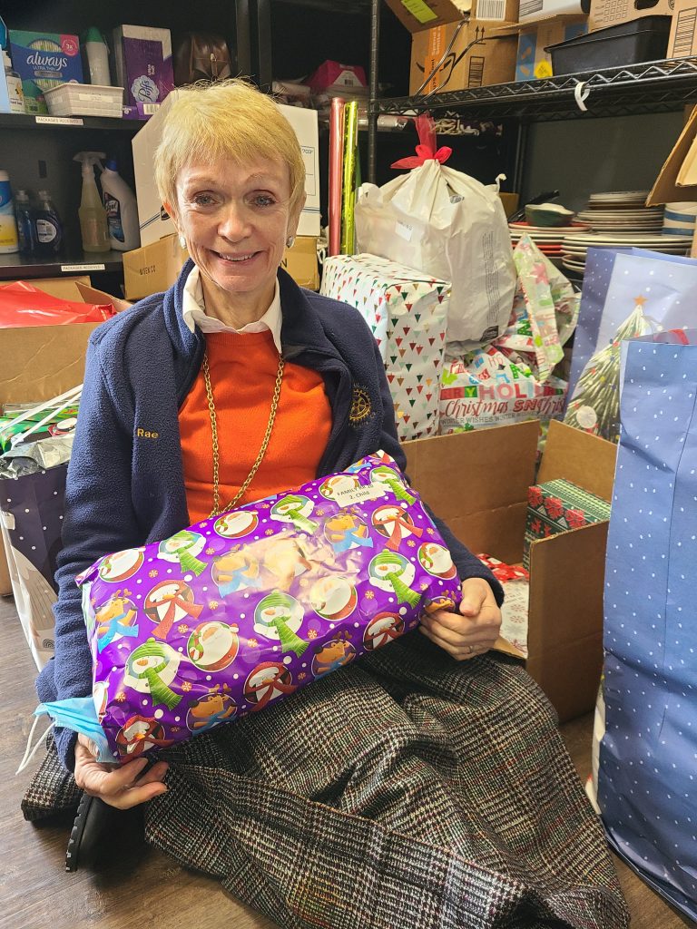 Mary Lou holding a present
