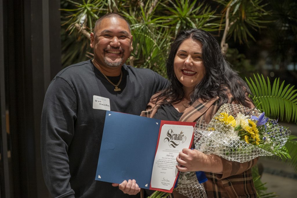 Man and woman holding certificate
