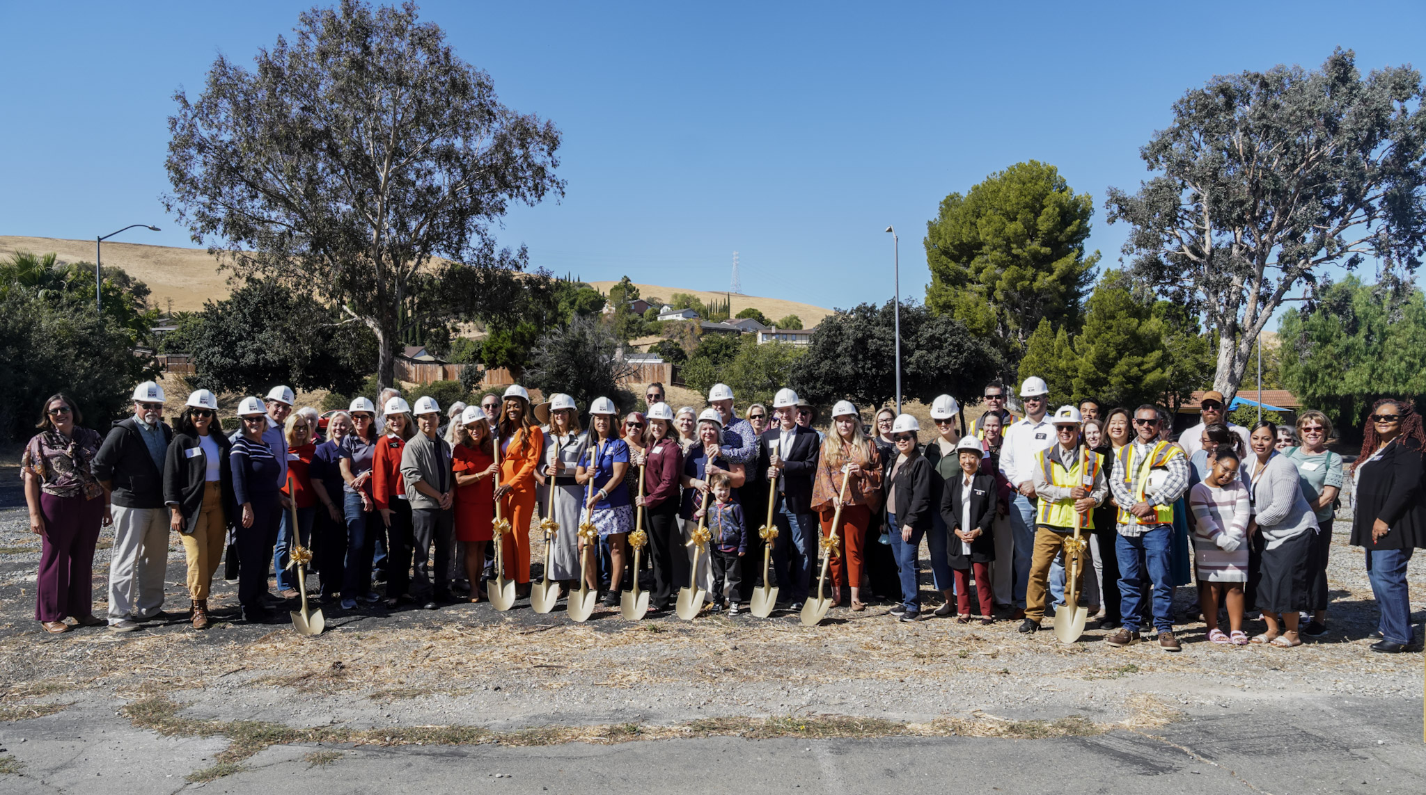 People gathering together to break ground on a construction project